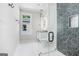 Modern bathroom featuring geometric shower, black fixtures, and oval mirror with vanity at 115 Thome, Alpharetta, GA 30022