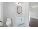 Modern bathroom features a sleek vanity, minimalist black hardware, and neutral color palette at 115 Thome, Alpharetta, GA 30022