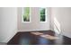 Inviting bedroom with warm sunlight and hardwood floors at 115 Thome, Alpharetta, GA 30022