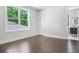 This light bedroom features hard wood floors and ensuite bathroom at 115 Thome, Alpharetta, GA 30022