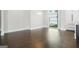Bright dining area with hardwood floors, large window, and built-in cabinetry at 115 Thome, Alpharetta, GA 30022