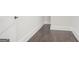Hallway with hardwood flooring and white trim at 115 Thome, Alpharetta, GA 30022