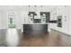 Modern kitchen with a large island, stainless steel appliances, and a stylish backsplash at 115 Thome, Alpharetta, GA 30022