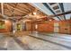 Spacious unfinished basement with concrete floors and exposed ceiling beams at 3452 Monica Sw Ln, Conyers, GA 30094