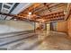 Unfinished basement with exposed beams and concrete floor at 3452 Monica Sw Ln, Conyers, GA 30094