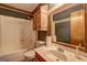 Bathroom with a white shower curtain and wood vanity at 3452 Monica Sw Ln, Conyers, GA 30094