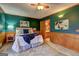 Cozy bedroom with a ceiling fan and beautiful wall art at 3452 Monica Sw Ln, Conyers, GA 30094
