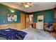 Comfortable bedroom with a ceiling fan and access to bathroom at 3452 Monica Sw Ln, Conyers, GA 30094