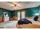 Bright bedroom features a ceiling fan and a sliding door to the deck at 3452 Monica Sw Ln, Conyers, GA 30094