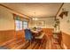 Dining room with views of outdoors and wood flooring at 3452 Monica Sw Ln, Conyers, GA 30094