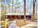 Charming front exterior of a house with a porch, wood accents, and a well-manicured lawn at 3452 Monica Sw Ln, Conyers, GA 30094