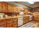 Charming kitchen with knotty pine cabinets, laminate counters and a view to the outdoors at 3452 Monica Sw Ln, Conyers, GA 30094