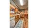 Open concept kitchen with knotty pine cabinets and vintage appliances at 3452 Monica Sw Ln, Conyers, GA 30094