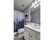 Bathroom with modern fixtures, white cabinets and a shower with nature themed shower curtain at 221 Ashley Trace Dr, Locust Grove, GA 30248