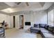 A cozy bedroom featuring comfortable sectional sofa seating, a tv, and two entrances at 221 Ashley Trace Dr, Locust Grove, GA 30248
