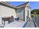 Deck featuring space for grilling and chilling with views of yard and horizon at 221 Ashley Trace Dr, Locust Grove, GA 30248