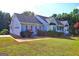 Attractive home showcasing a two-car garage, nice lawn, and an inviting curb appeal at 221 Ashley Trace Dr, Locust Grove, GA 30248