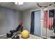 Home gym featuring exercise equipment, fitness ball, and weight training station for convenient workouts at 221 Ashley Trace Dr, Locust Grove, GA 30248