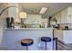 Bright kitchen features a breakfast bar with seating and modern appliances at 221 Ashley Trace Dr, Locust Grove, GA 30248