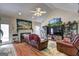 Inviting living room with hardwood floors, large fireplace, and vaulted ceilings at 221 Ashley Trace Dr, Locust Grove, GA 30248