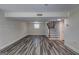 Basement area showcasing durable vinyl flooring, staircase, and neutral paint throughout, providing a versatile living space at 1026 Ponderosa Park Dr, Forest Park, GA 30297