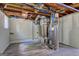 Unfinished basement showcases exposed pipes and mechanical components, offering a glimpse into the home's infrastructure and systems at 1026 Ponderosa Park Dr, Forest Park, GA 30297