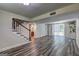 Finished basement with staircase, sliding glass door to backyard, vinyl flooring, and neutral wall color, offering great potential at 1026 Ponderosa Park Dr, Forest Park, GA 30297
