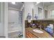 Updated bathroom with granite counters, a wood vanity, and a shower-tub combination at 1026 Ponderosa Park Dr, Forest Park, GA 30297