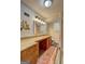 This cozy basement bathroom has granite countertop, stylish mirror, and shower, featuring vinyl floors and plenty of light at 1026 Ponderosa Park Dr, Forest Park, GA 30297