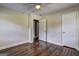 Bedroom with hardwood floors, base molding, and neutral walls at 1026 Ponderosa Park Dr, Forest Park, GA 30297