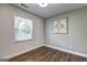 Bedroom with hardwood floors, neutral paint, and a window that offers natural light at 1026 Ponderosa Park Dr, Forest Park, GA 30297