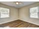 This bedroom is bright with natural light, hardwood floors, and neutral walls at 1026 Ponderosa Park Dr, Forest Park, GA 30297