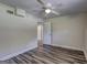 This bedroom has durable vinyl flooring, a ceiling fan, and a door to hall, offering a nice retreat at 1026 Ponderosa Park Dr, Forest Park, GA 30297