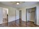 Large bedroom with hardwood floors, a ceiling fan, bathroom, and closet at 1026 Ponderosa Park Dr, Forest Park, GA 30297