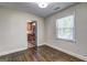 Bright bedroom features hardwood floors, a window, and an adjoining kitchen space at 1026 Ponderosa Park Dr, Forest Park, GA 30297