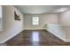 Upstairs hallway boasts gleaming wood floors and ample natural light from the window at 1026 Ponderosa Park Dr, Forest Park, GA 30297