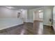 Hallway boasts gleaming wood floors and ample natural light leading to the rooms at 1026 Ponderosa Park Dr, Forest Park, GA 30297