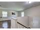 Bright hallway landing with wood floors and fresh paint leading to the home's entrance at 1026 Ponderosa Park Dr, Forest Park, GA 30297