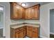 Well-designed kitchen corner with wooden cabinets, granite counters, and ample storage space at 1026 Ponderosa Park Dr, Forest Park, GA 30297