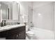 Modern bathroom featuring granite counters, a framed mirror, and shower-tub combination at 1596 Fearn Ne Cir, Brookhaven, GA 30319