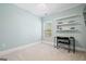 Bedroom featuring light blue walls, white trim, and a modern desk setup at 1596 Fearn Ne Cir, Brookhaven, GA 30319
