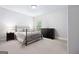 Spacious bedroom with carpet, black dresser, and natural light from the window at 1596 Fearn Ne Cir, Brookhaven, GA 30319