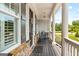Inviting front porch with rocking chairs, stone accents, and classic columns at 1596 Fearn Ne Cir, Brookhaven, GA 30319
