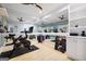 Home gym with peloton bike, weights, mirror wall, and mounted TV's at 1596 Fearn Ne Cir, Brookhaven, GA 30319