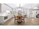 Open-concept kitchen with white cabinets, stainless steel appliances, and an eat-in dining area at 1596 Fearn Ne Cir, Brookhaven, GA 30319