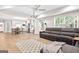 Spacious open-concept living room with hardwood floors, a large sectional couch, and a ceiling fan at 1596 Fearn Ne Cir, Brookhaven, GA 30319