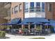 Charming restaurant with a patio, blue awnings, outdoor seating and a brick exterior at 1596 Fearn Ne Cir, Brookhaven, GA 30319
