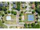 Aerial view of community amenities: pool, tennis court, and playground, offering recreational options at 3842 Monticello St, Douglasville, GA 30135