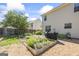 Well-maintained backyard featuring an enclosed garden and a manicured lawn at 3842 Monticello St, Douglasville, GA 30135