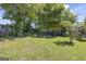 Large backyard with green grass and garden beds for outdoor enjoyment at 3842 Monticello St, Douglasville, GA 30135